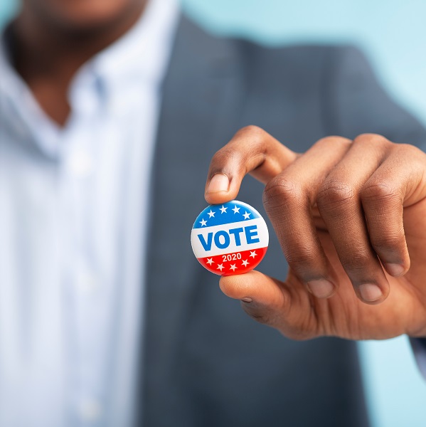 Person of Color holding a vote button